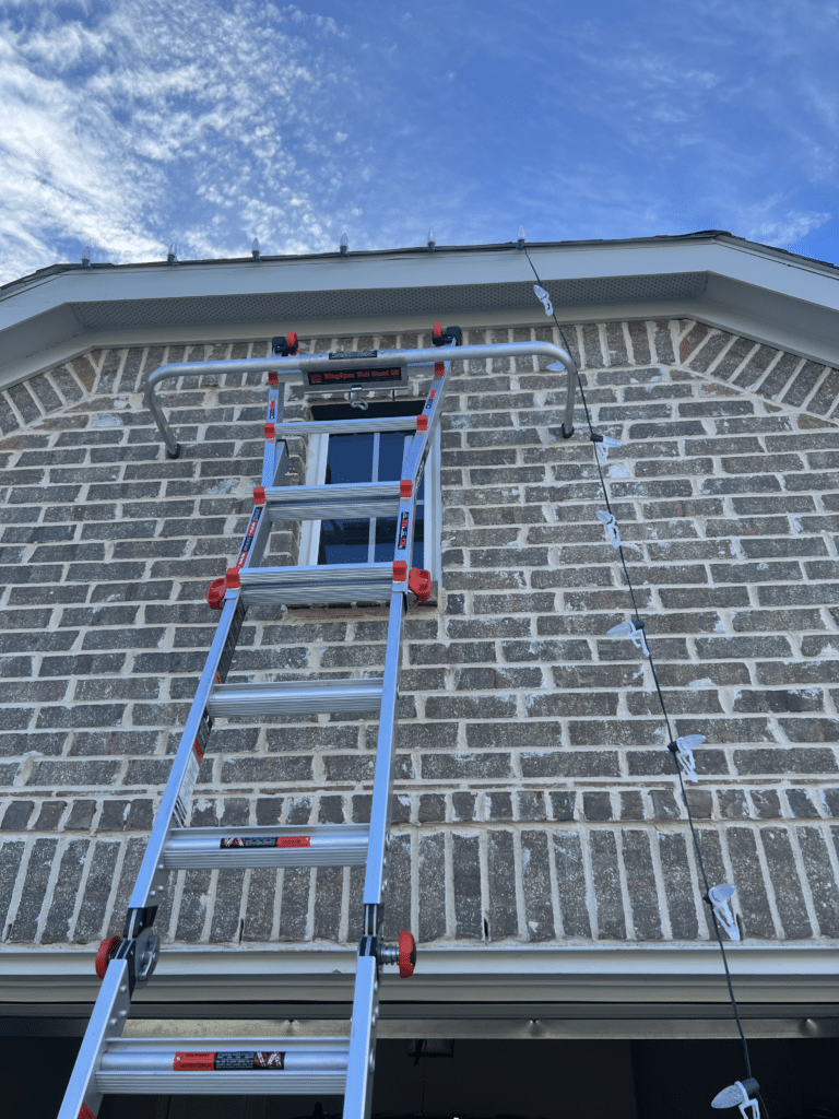 Holiday Night Lights customer using shingle tabs to hang lights