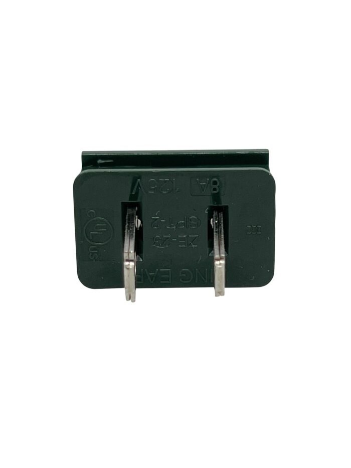 A green rectangular electrical component with two metal prongs facing forward. The component has embossed text on its surface that reads "EATON," "7GFP," "13A," among other alphanumeric characters. Ideal for wholesale Christmas lights, the prongs are parallel and extend from the bottom.