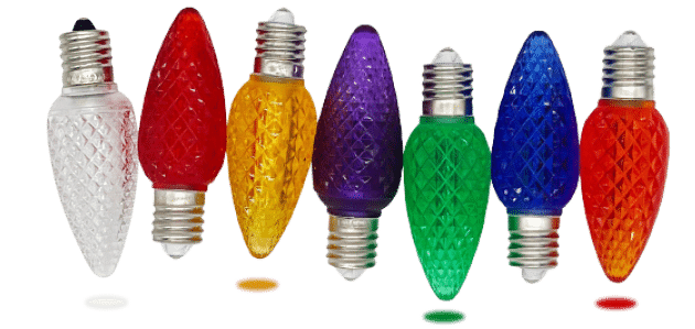 A row of seven colorful LED light bulbs against a white background. The bulbs, ideal for professional Christmas lights setups, come in clear, red, yellow, purple, green, blue, and red. Each bulb features a textured surface and screw base. Small circular color discs are placed below the bulbs.